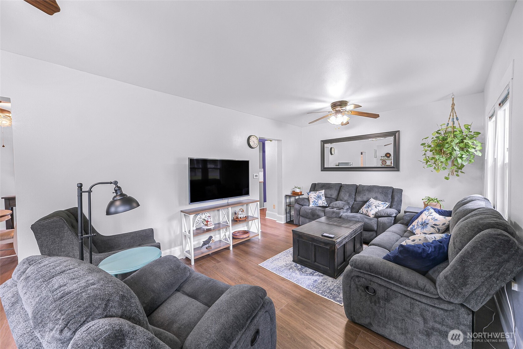 6981 Hannegan Road Lynden, WA 98264 - Photo 4 of 25 a living room with furniture and a flat screen tv