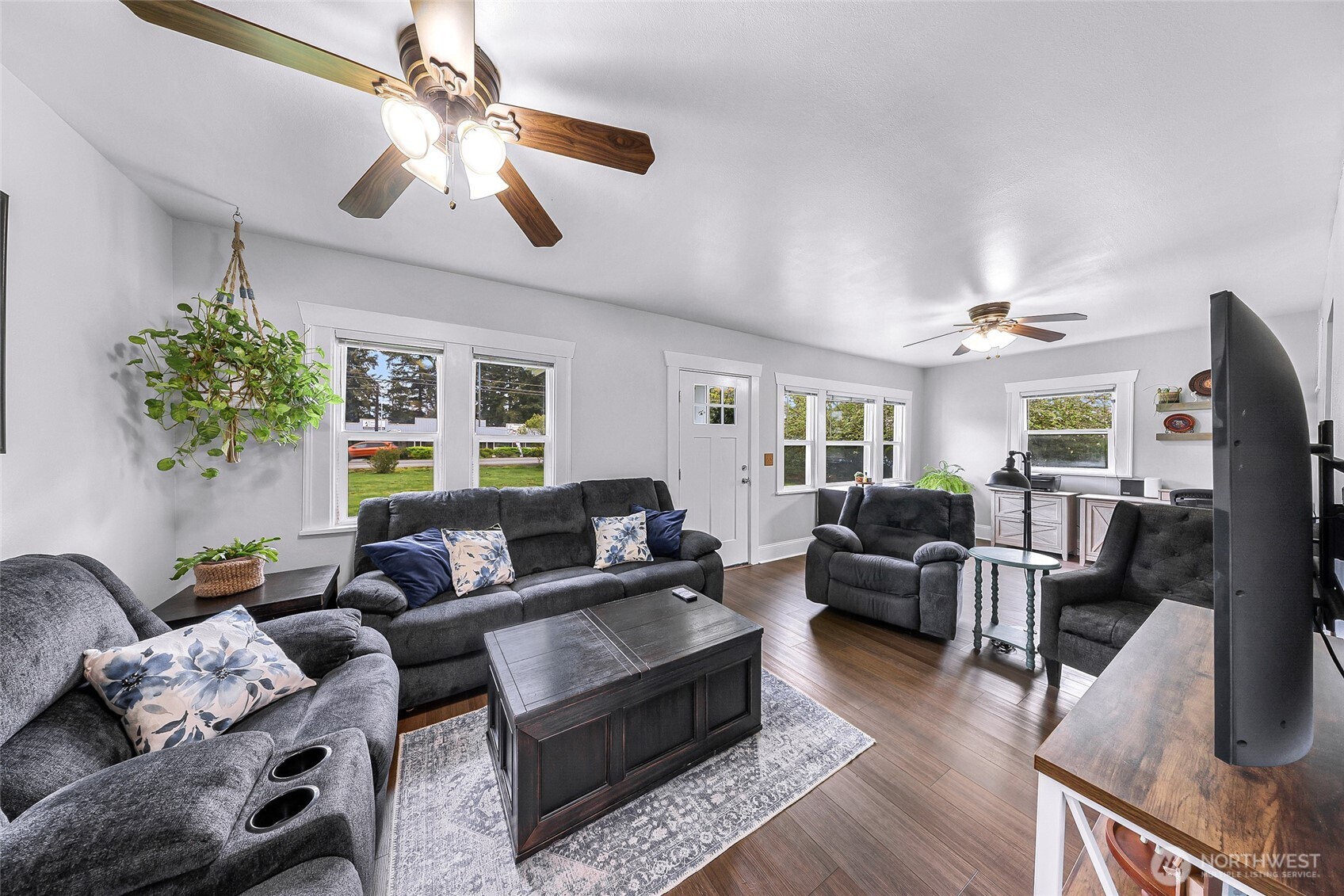 6981 Hannegan Road Lynden, WA 98264 - Photo 6 of 25 a living room with furniture and a flat screen tv