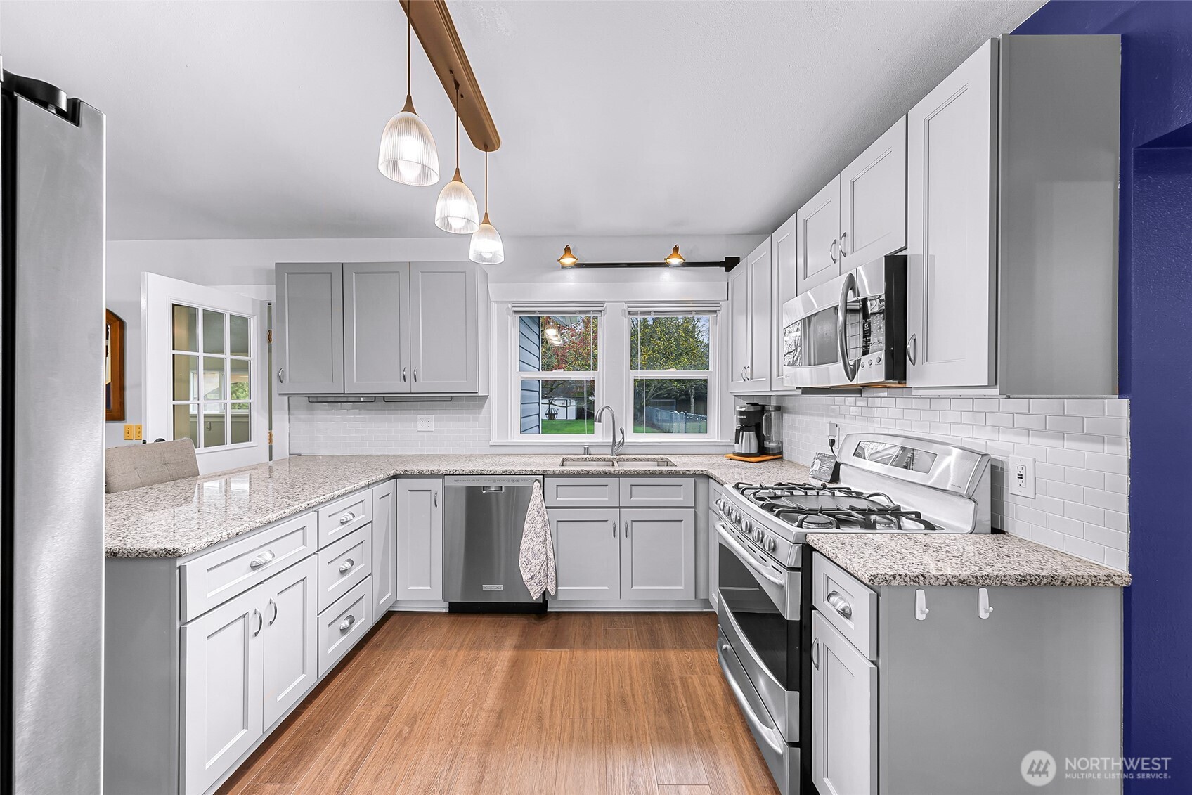 6981 Hannegan Road Lynden, WA 98264 - Photo 8 of 25 a kitchen with a white cabinets stove and sink