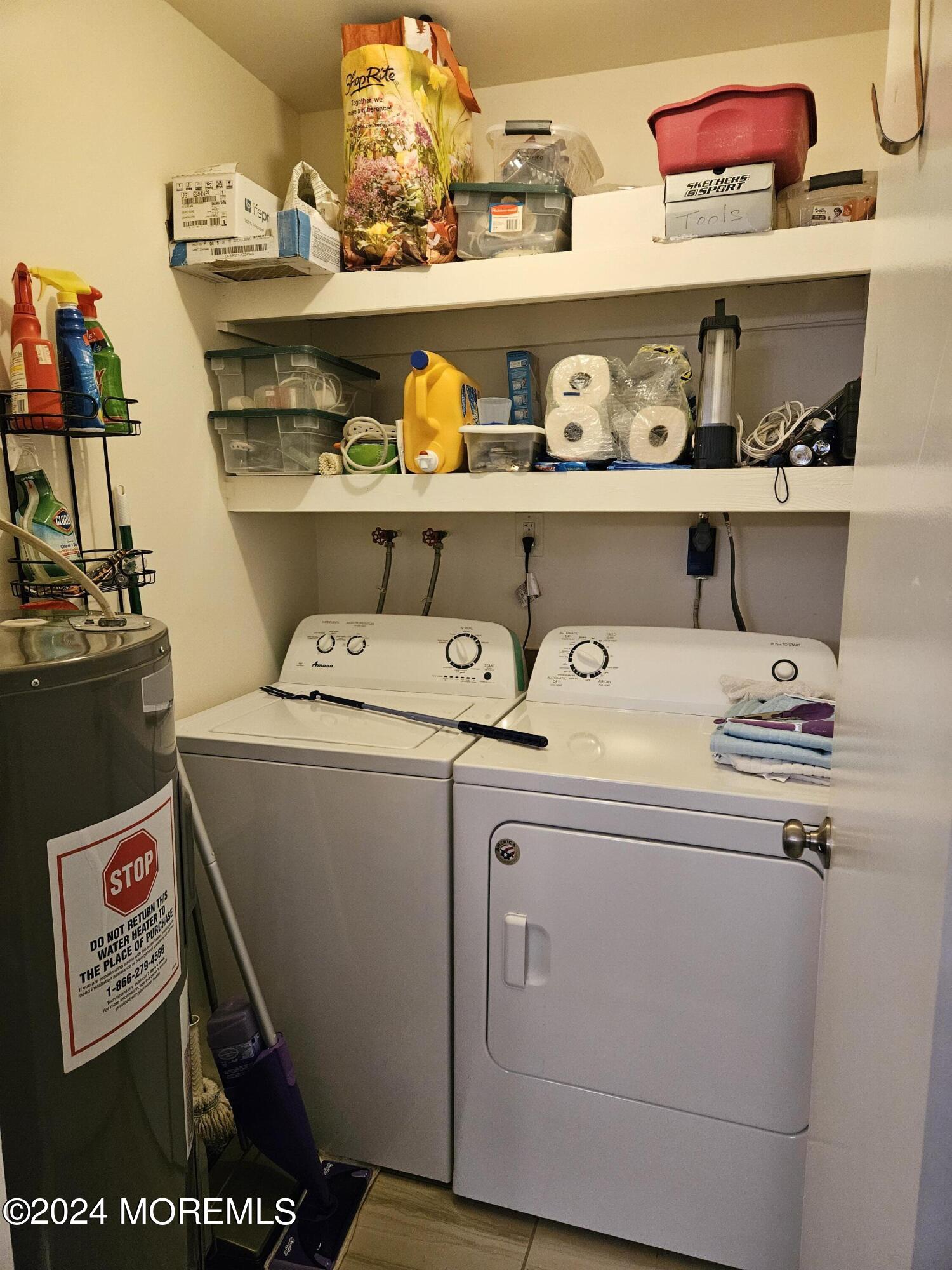 75 Overlook Way, Unit E Manalapan, NJ 07726 - Photo 12 of 12 a utility room with washer and dryer