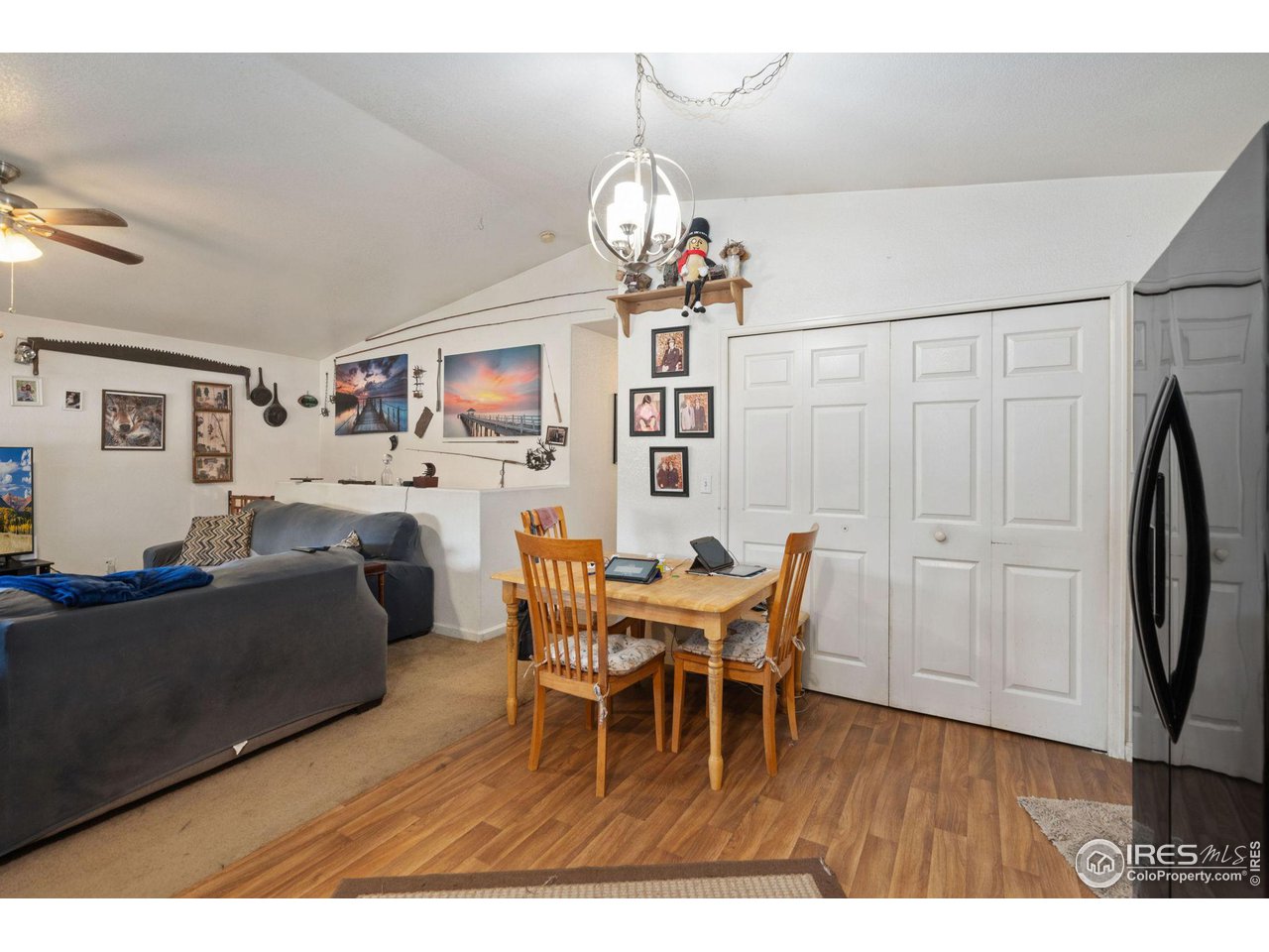 213 East 21st Street Road Greeley, CO 80631 - Photo 8 of 18 a view of a dining room with furniture and wooden floor