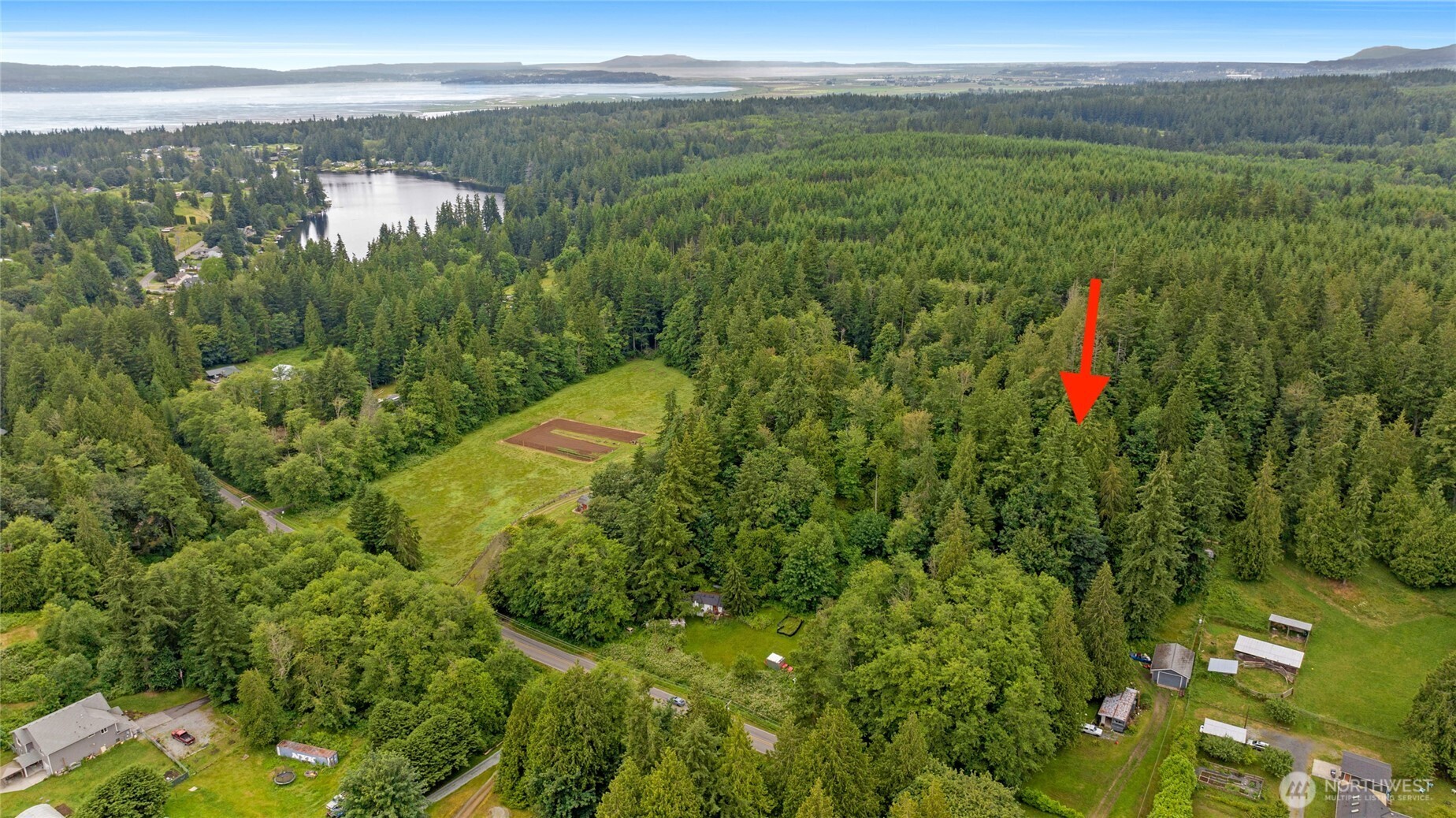 a view of a lake with a yard