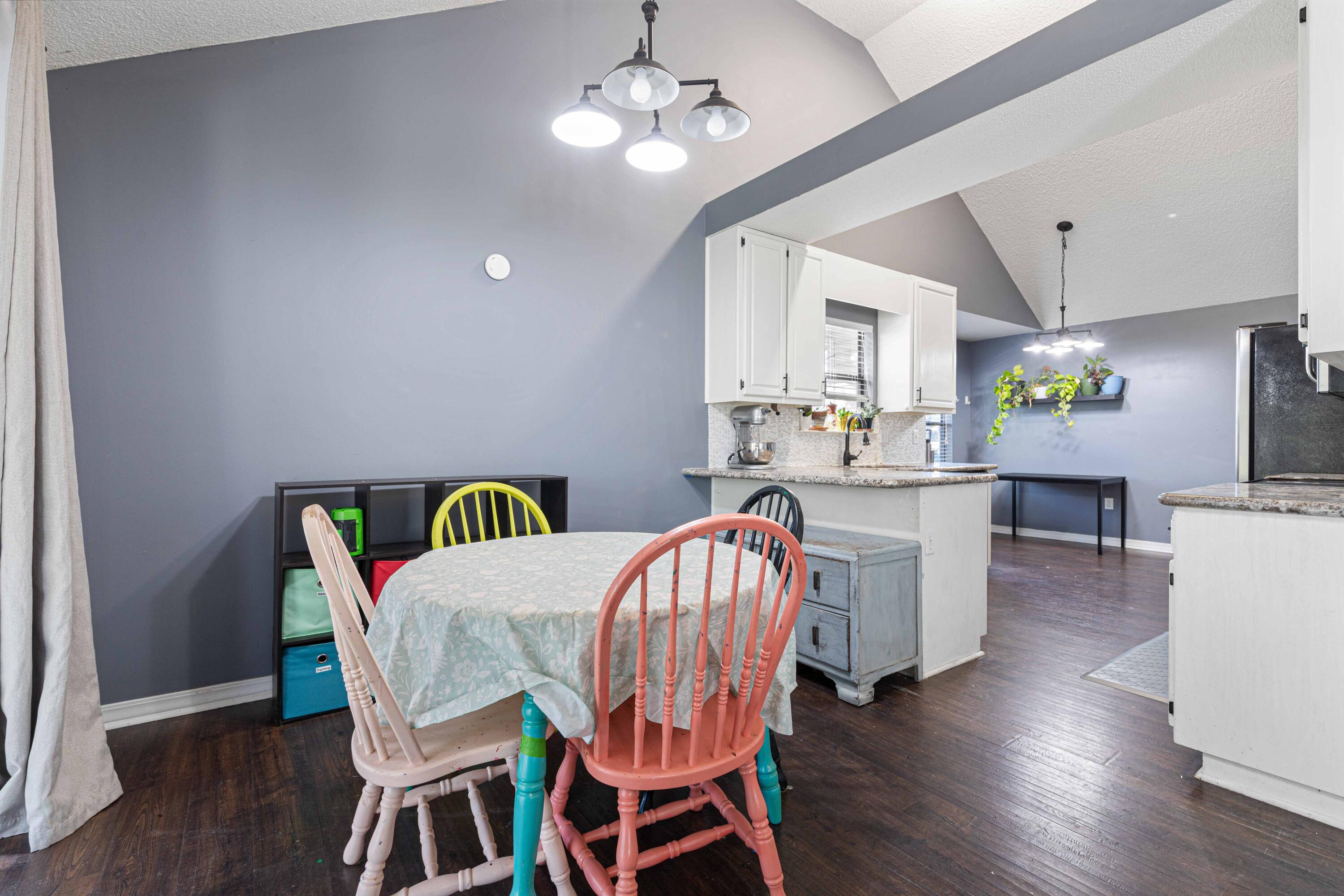 1920 Seahawk Lane Navarre, FL 32566 - Photo 12 of 30 a dining room with furniture a chandelier and wooden floor