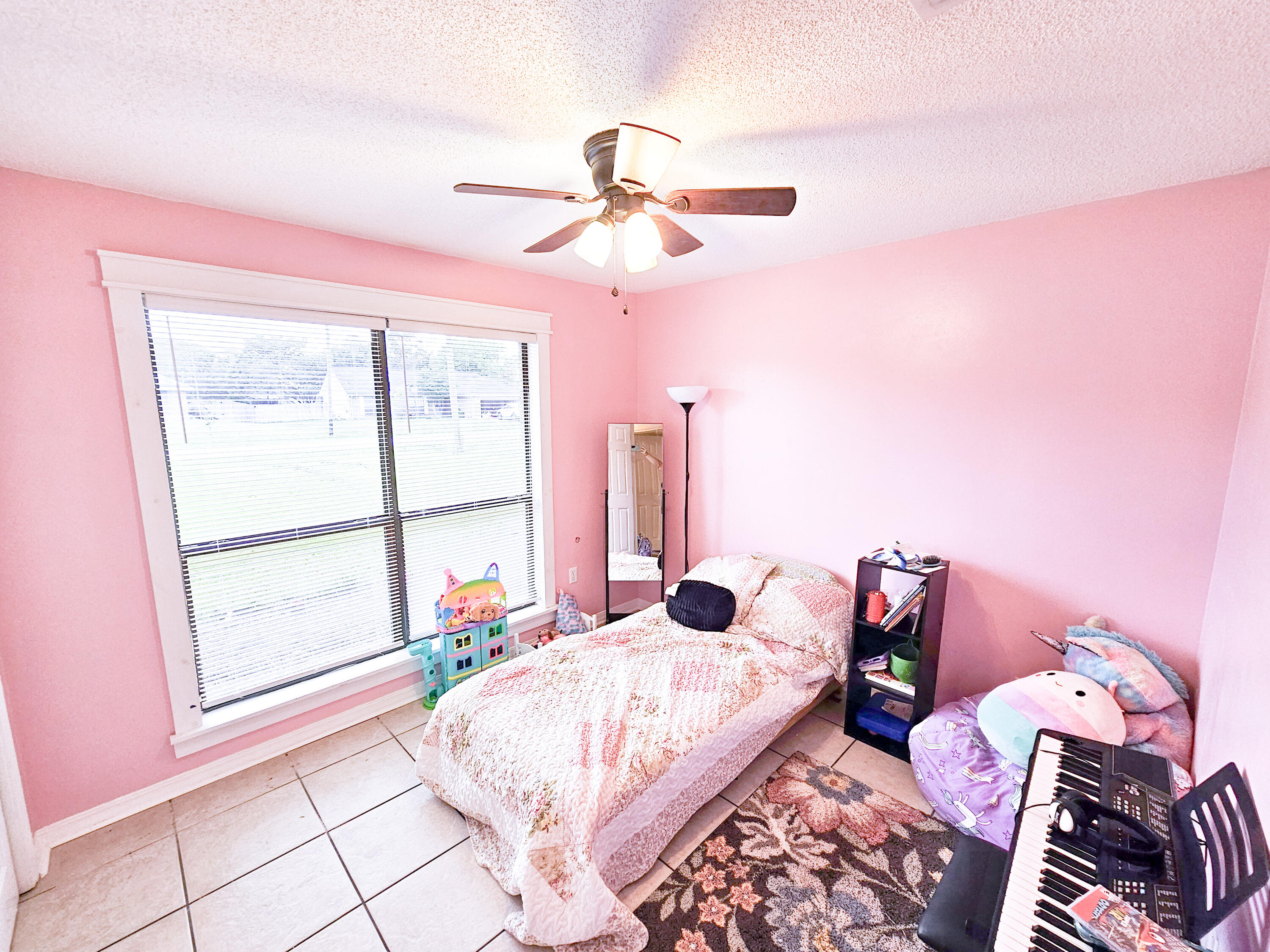 1920 Seahawk Lane Navarre, FL 32566 - Photo 18 of 30 a bedroom with a bed and a window