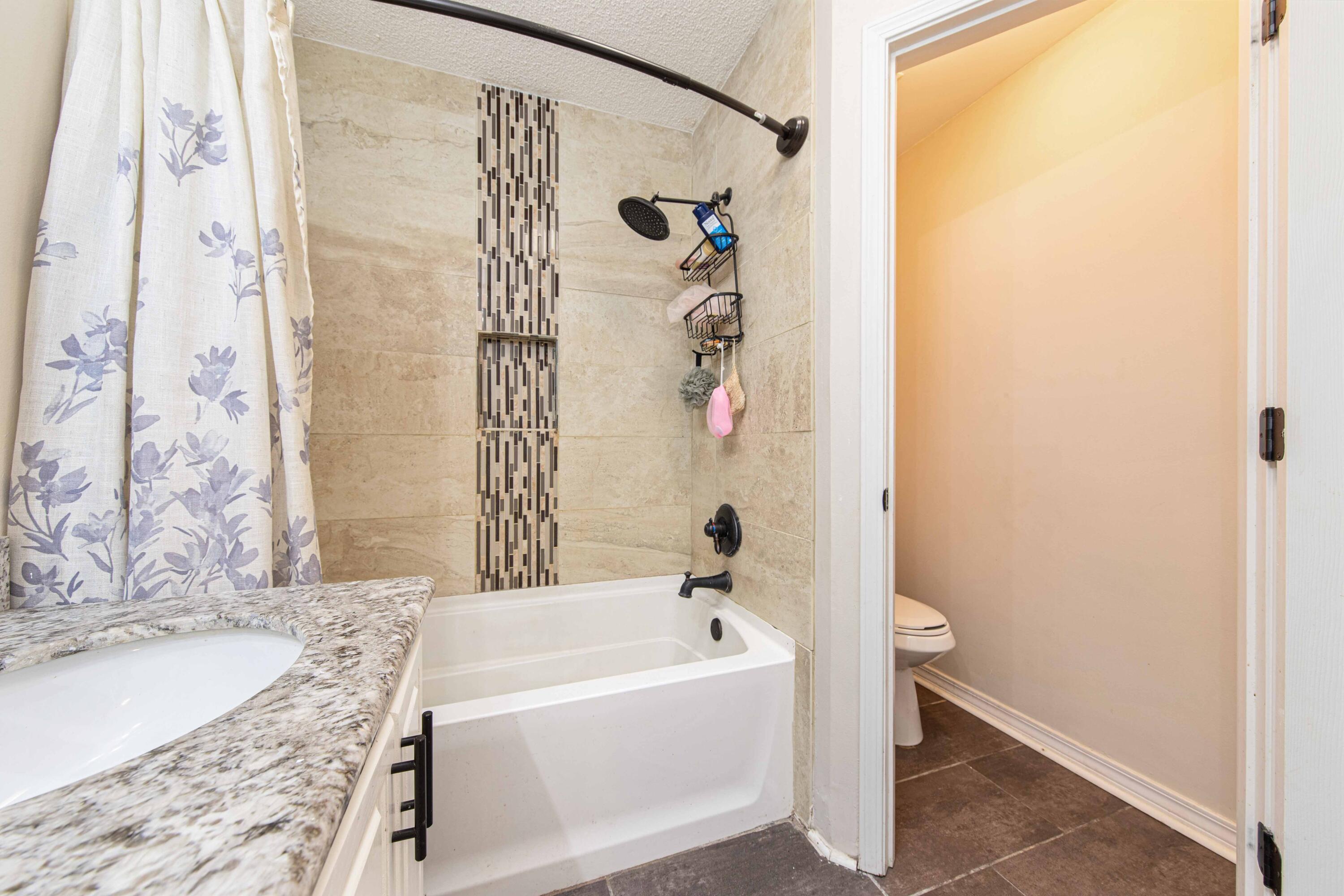 1920 Seahawk Lane Navarre, FL 32566 - Photo 24 of 30 a bathroom with a bathtub and shower