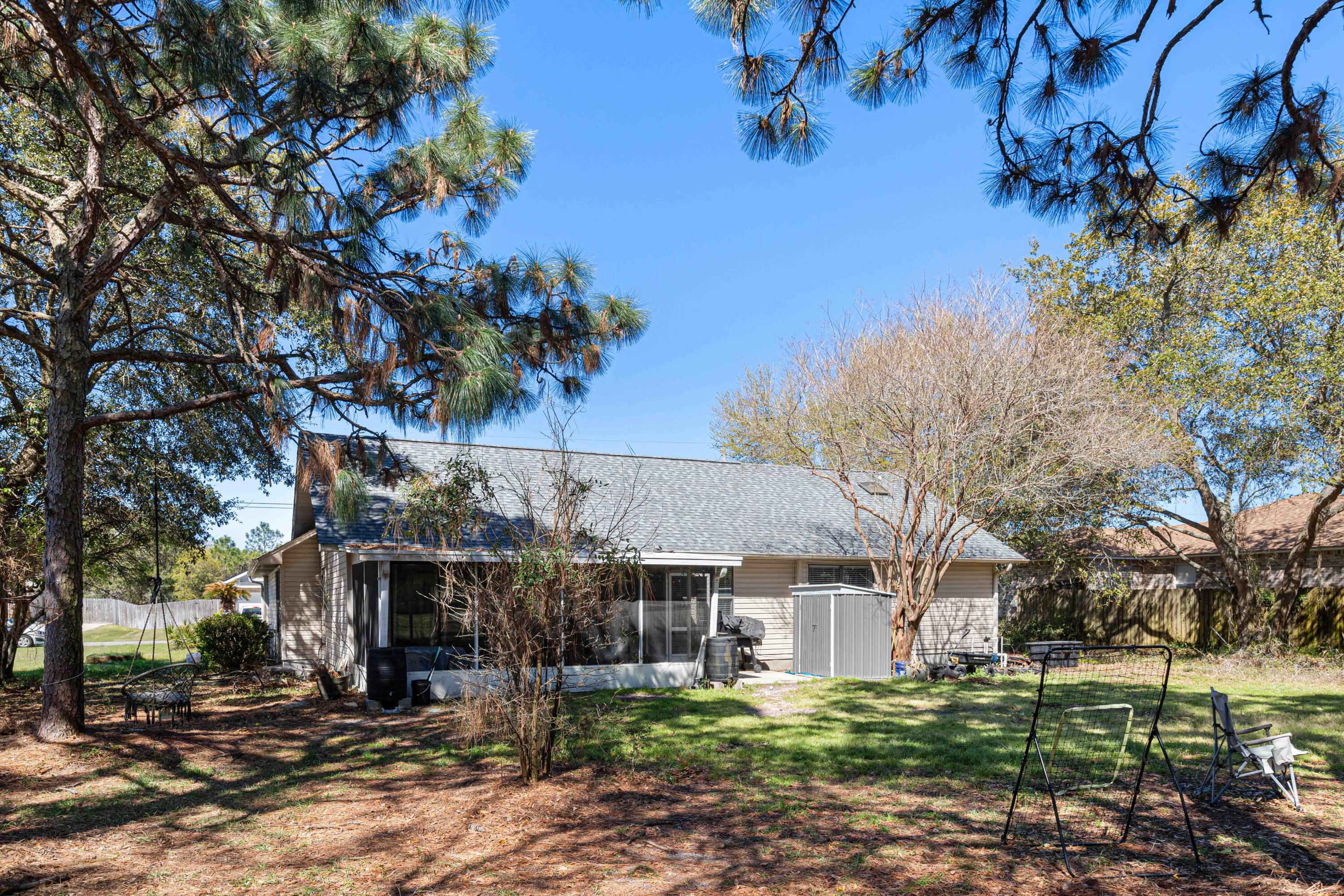 1920 Seahawk Lane Navarre, FL 32566 - Photo 27 of 30 a view of a house with a yard