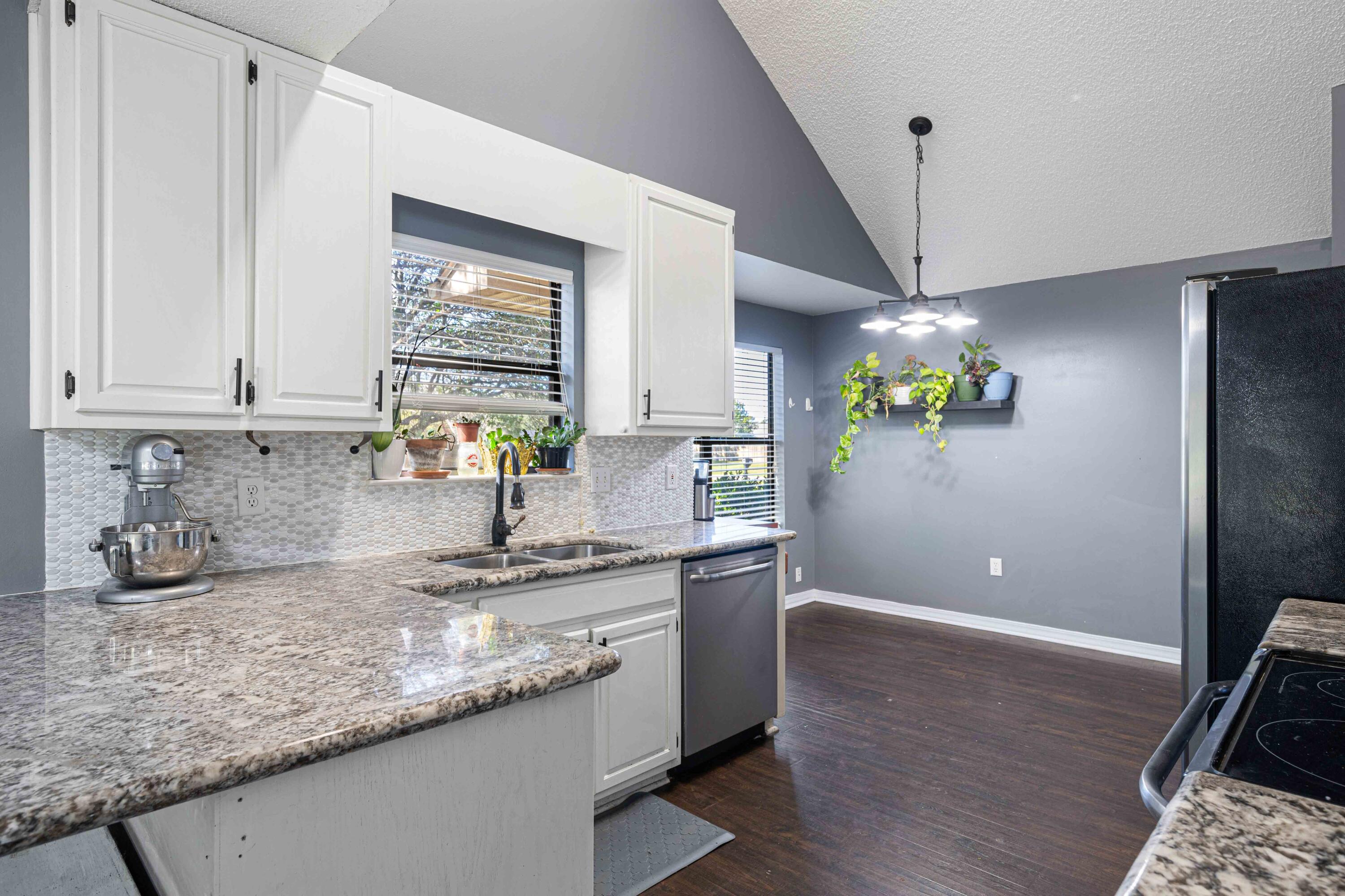 1920 Seahawk Lane Navarre, FL 32566 - Photo 4 of 30 a kitchen with stainless steel appliances granite countertop a sink a counter space and cabinets