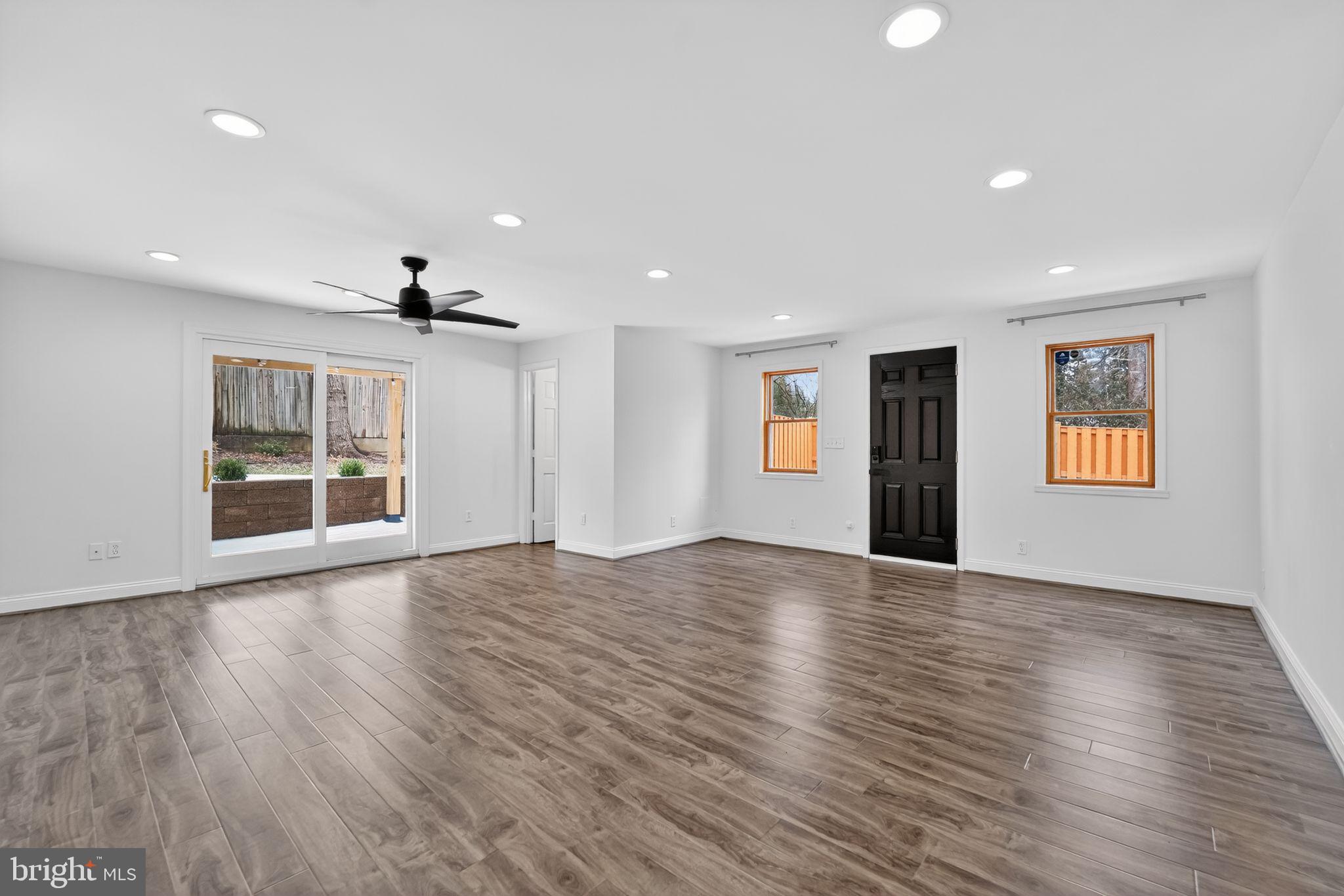 3511 Decatur Avenue Kensington, MD 20895 - Photo 12 of 35 a view of an empty room with a window and wooden floor