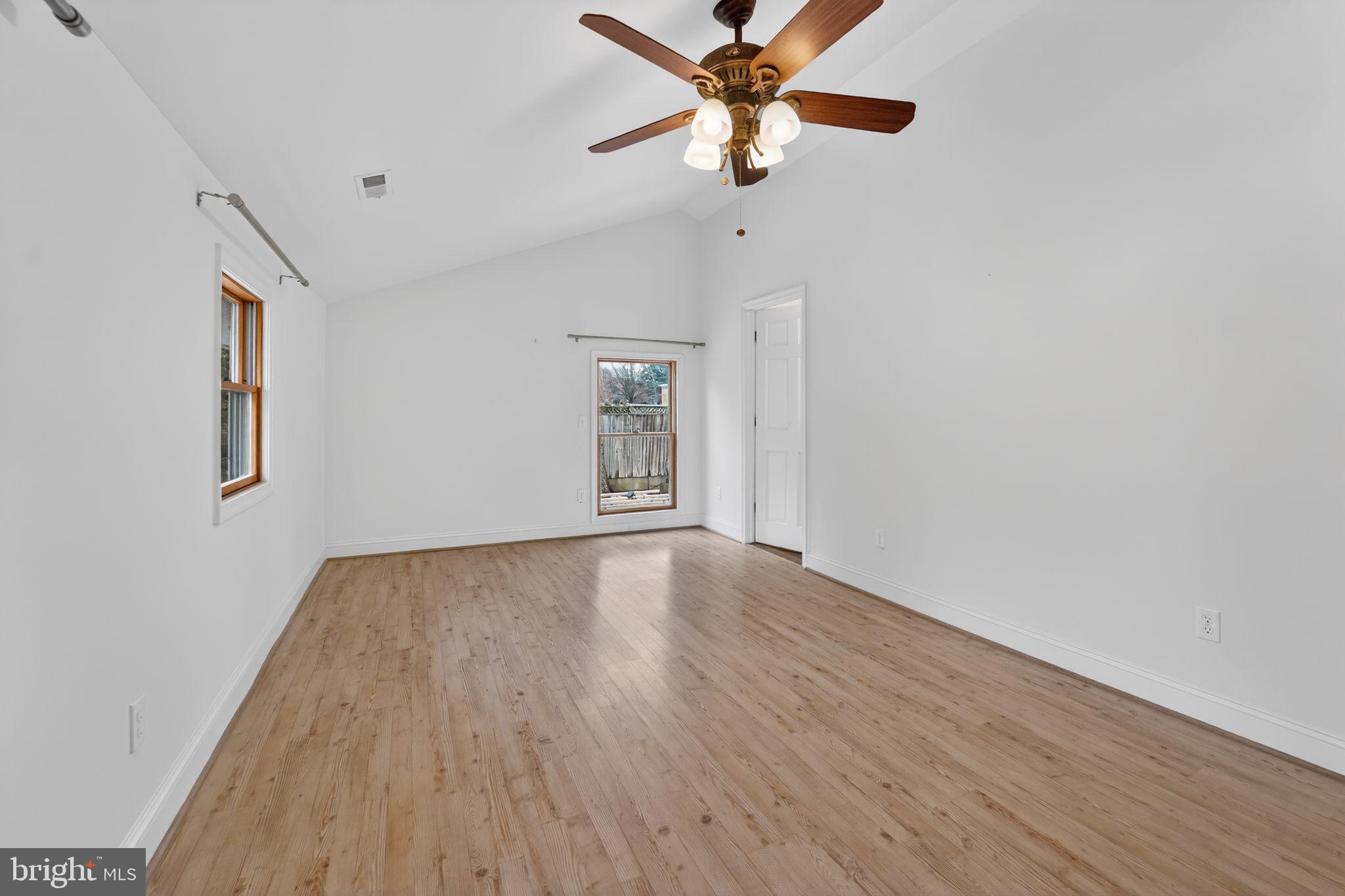 3511 Decatur Avenue Kensington, MD 20895 - Photo 21 of 35 an empty room with wooden floor fan and windows