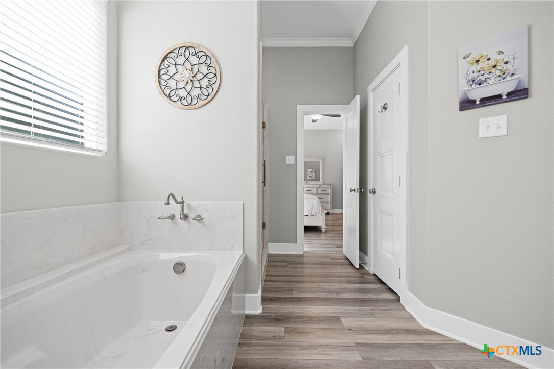 28099 Fm 2670 Killeen, TX 76549 - Photo 14 of 48 a spacious bathroom with a bathtub and a shower