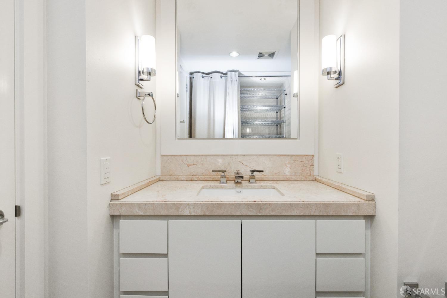 188 Minna, Unit 33A San Francisco, CA 94105 - Photo 13 of 29 a bathroom with a sink and a mirror