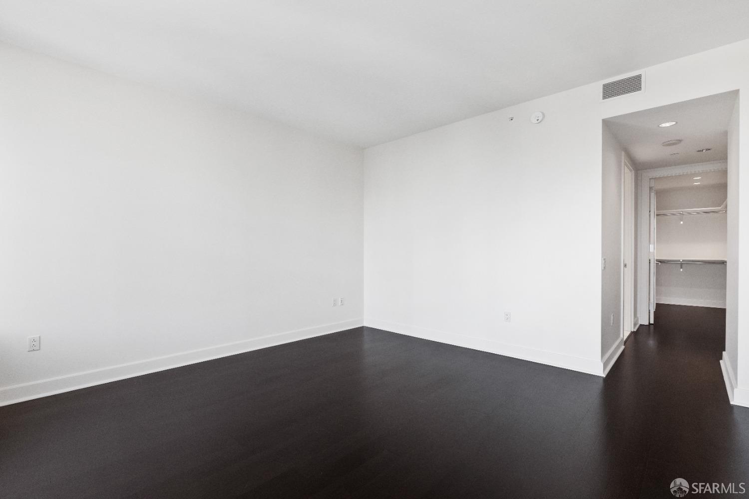 188 Minna, Unit 33A San Francisco, CA 94105 - Photo 15 of 29 an empty room with a wooden floor and a window