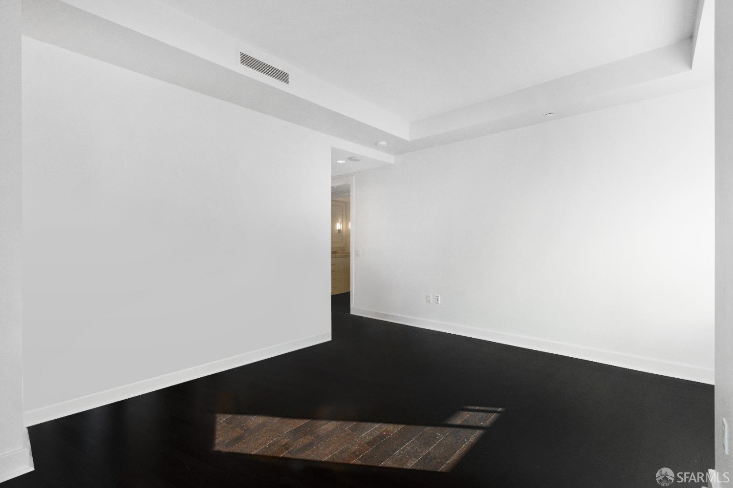 188 Minna, Unit 33A San Francisco, CA 94105 - Photo 22 of 29 an empty room with wooden floor