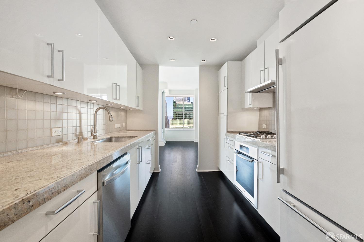 188 Minna, Unit 33A San Francisco, CA 94105 - Photo 3 of 29 a kitchen with stainless steel appliances granite countertop hardwood floor sink stove and cabinets