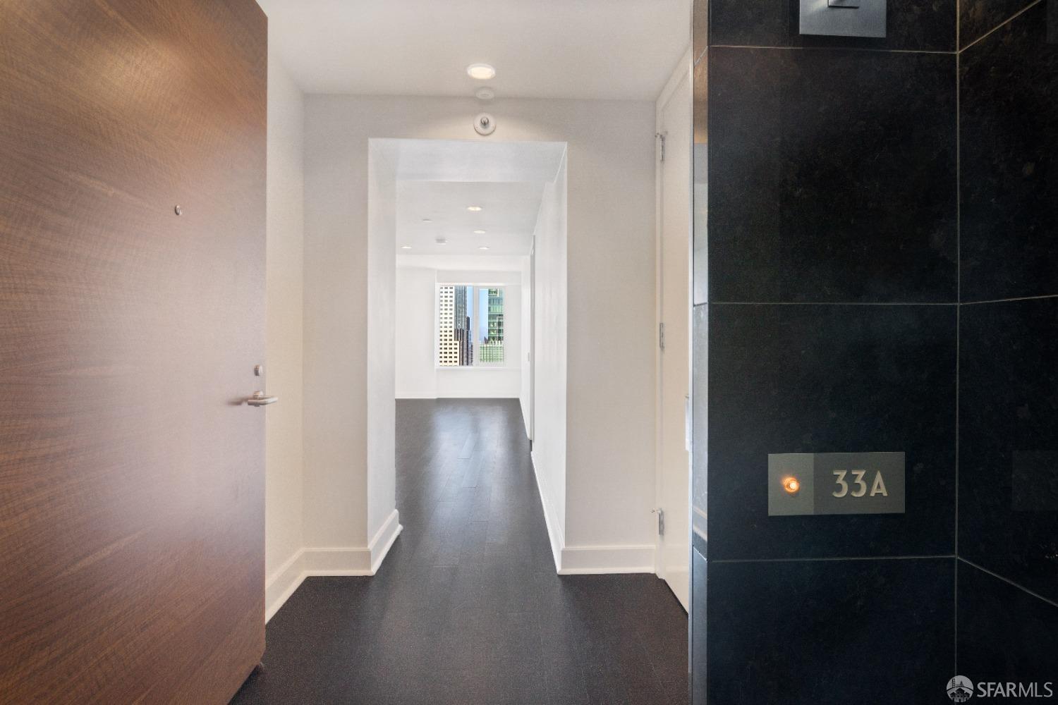 188 Minna, Unit 33A San Francisco, CA 94105 - Photo 6 of 29 a view of a hallway with wooden floor