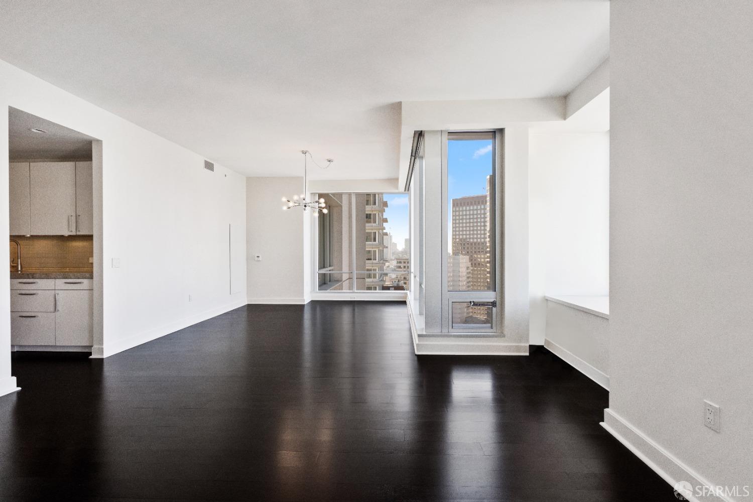188 Minna, Unit 33A San Francisco, CA 94105 - Photo 10 of 29 a view of an empty room with wooden floor and a window
