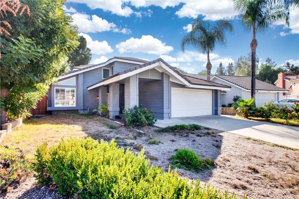 75 Rising Hill Road Pomona, CA 91766 - Photo 1 of 1 a front view of a house with garden