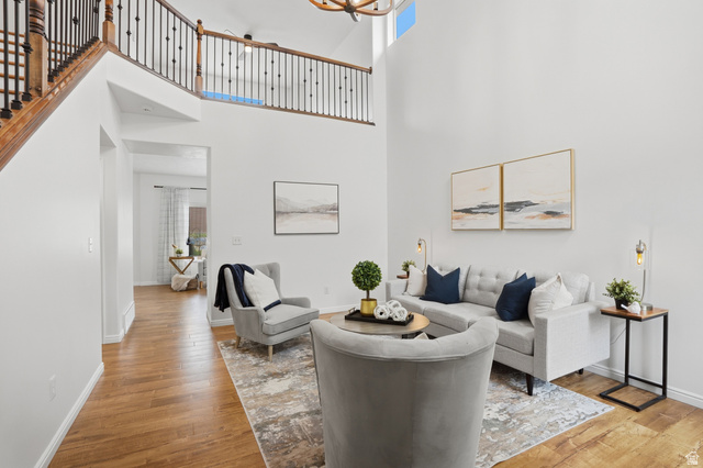 2007 Fielding Hill Lane Draper, UT 84020 - Photo 6 of 83 Vaulted ceilings define this inviting living space, featuring wood-finish flooring throughout the main level
