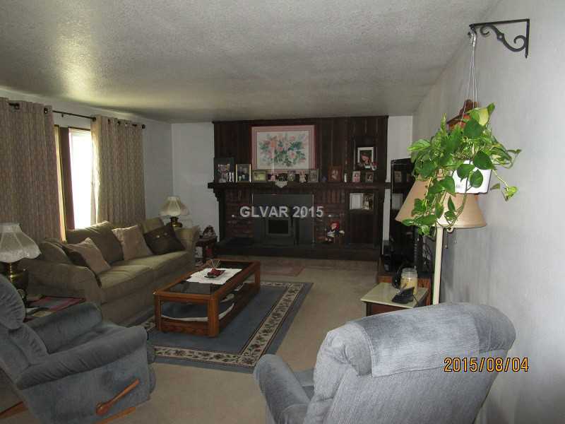 1074 Ricegrass Lane Tonopah, NV 89049 - Photo 2 of 11 Living Room. Energy efficient , wood-burning fireplace