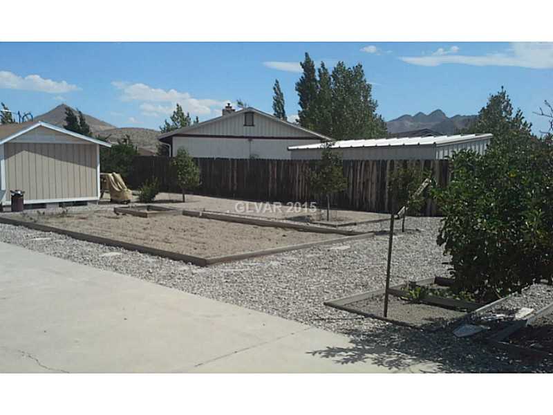 1074 Ricegrass Lane Tonopah, NV 89049 - Photo 10 of 11 Patio/Deck. Patio and storage sheds