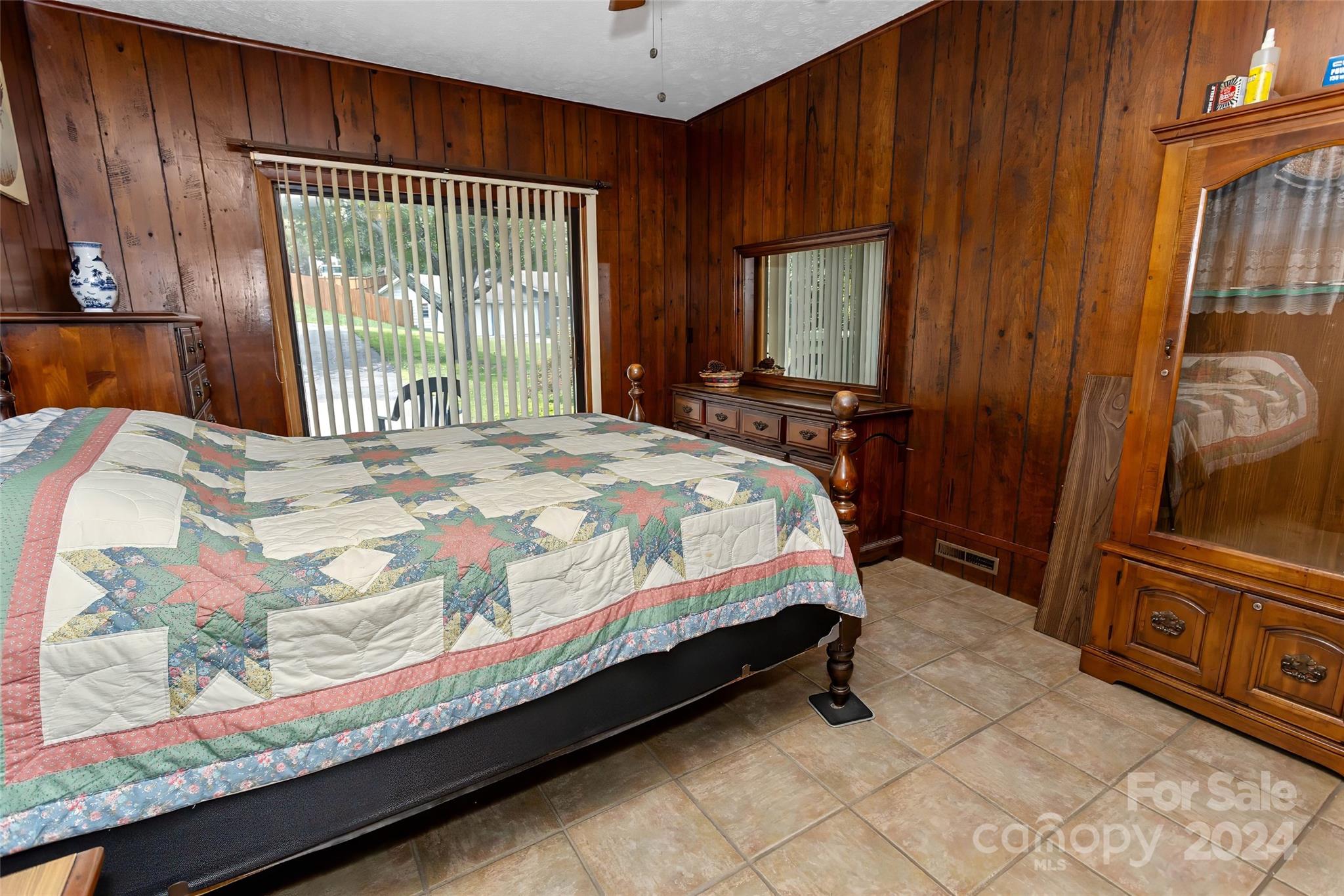 45 Cub Road Asheville, NC 28806 - Photo 16 of 46 a bed sitting in a bedroom next to a window