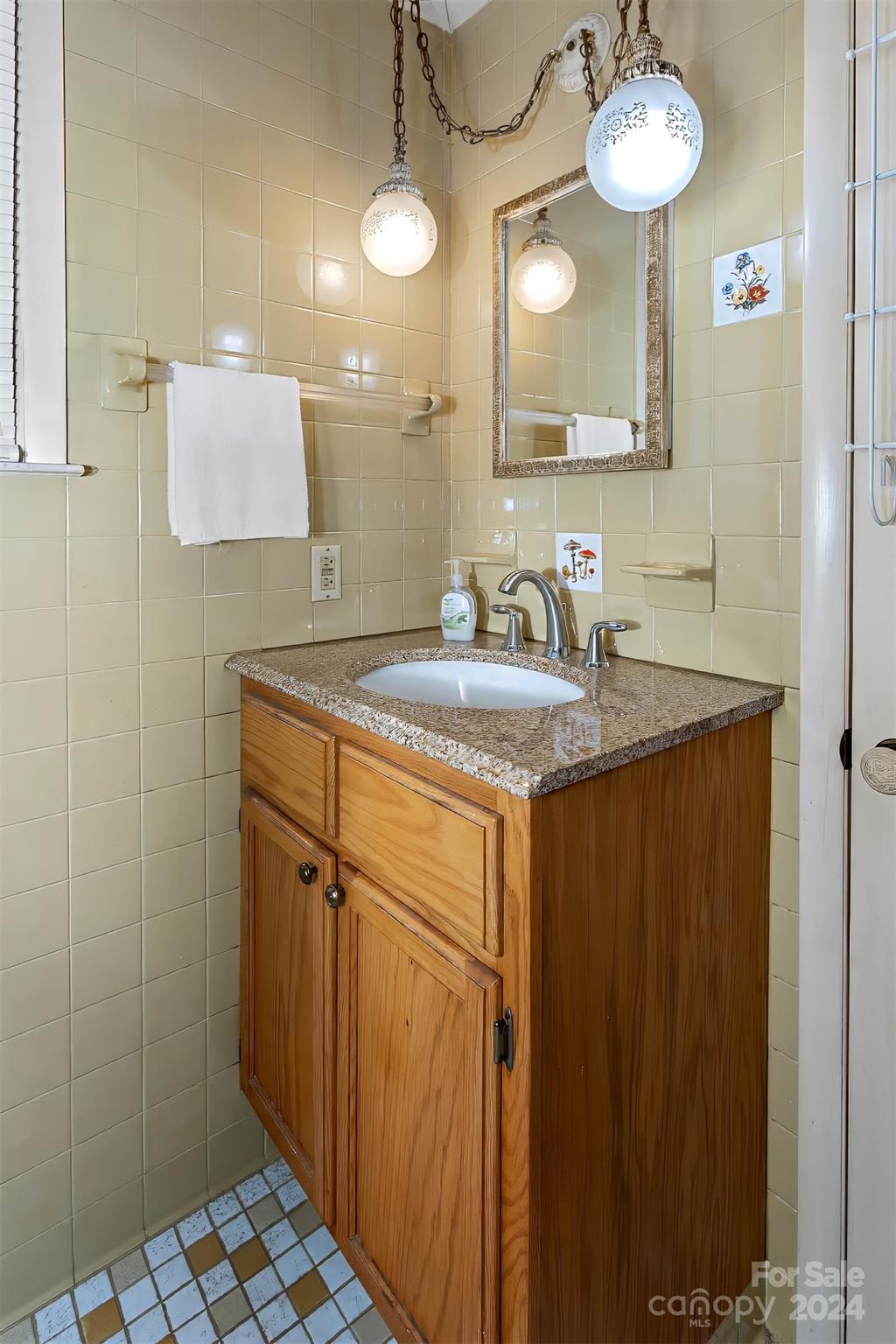 45 Cub Road Asheville, NC 28806 - Photo 18 of 46 a bathroom with a sink and a mirror