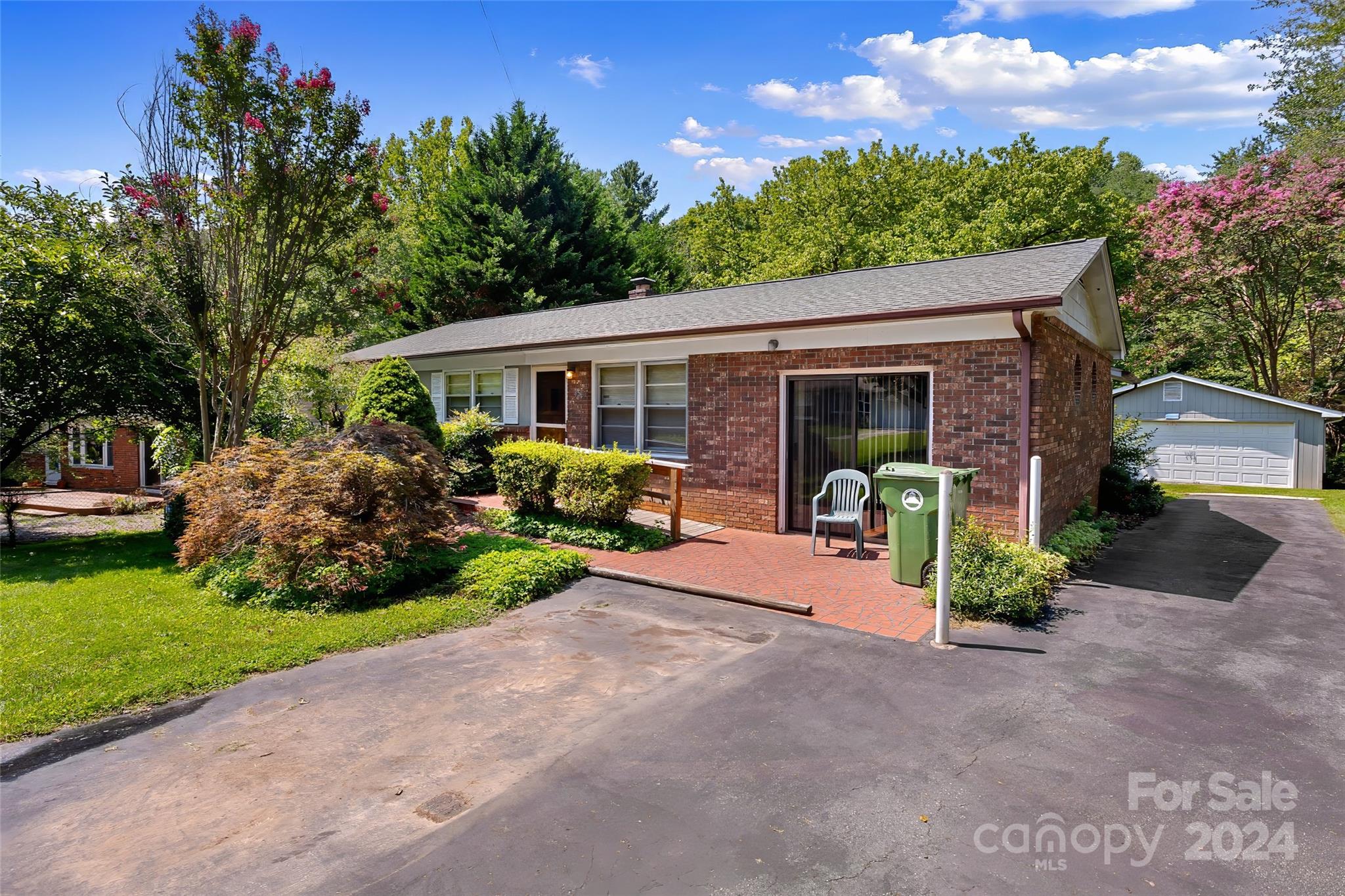 45 Cub Road Asheville, NC 28806 - Photo 2 of 46 a front view of a house with garden and plants