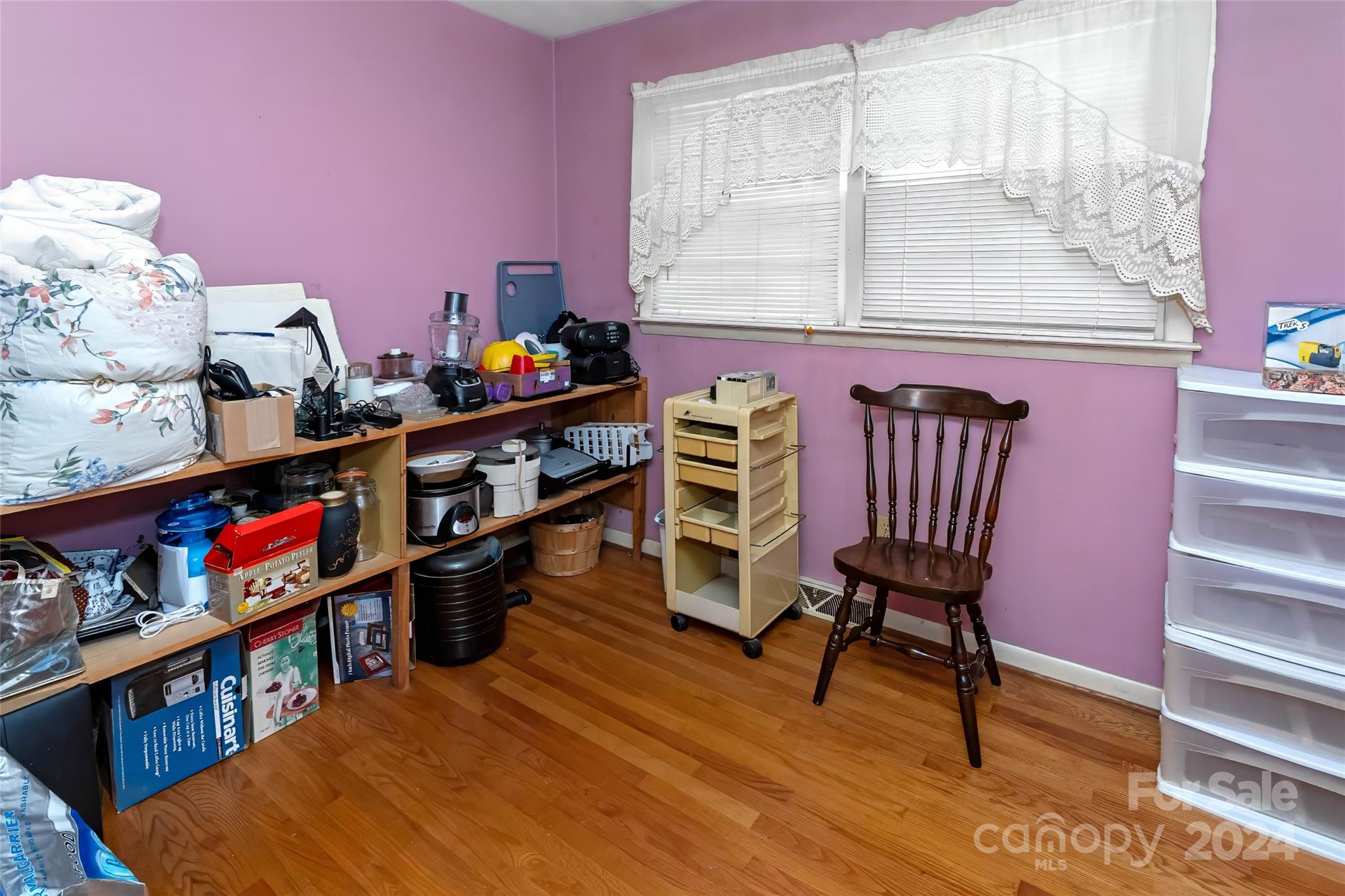 45 Cub Road Asheville, NC 28806 - Photo 28 of 46 a view of a workspace with furniture and a book shelf