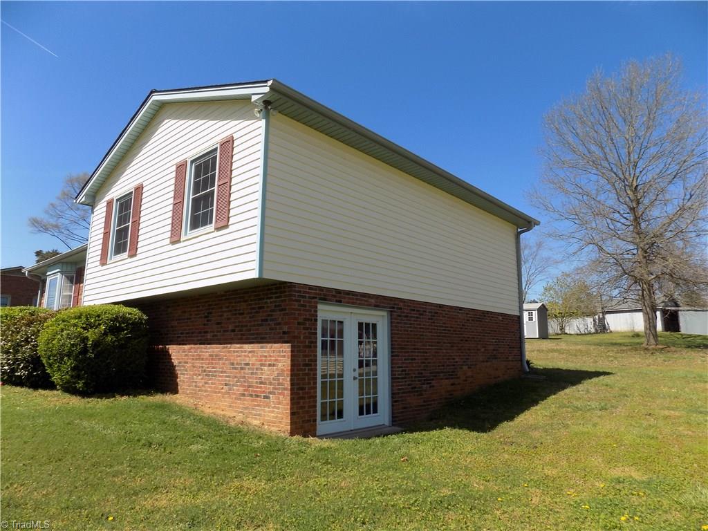 3104 Tyro Road Lexington, NC 27295 - Photo 2 of 28 Side view shows french doors from unfinished basement area
