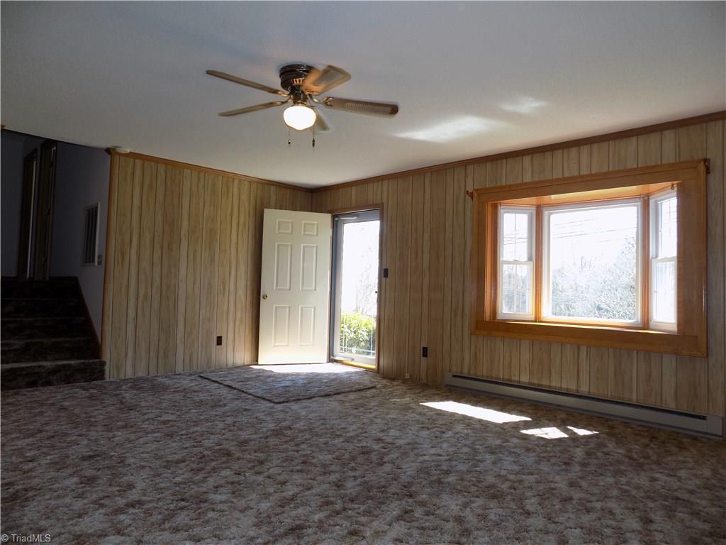 3104 Tyro Road Lexington, NC 27295 - Photo 14 of 28 Generously oversized living room with front and side entrance.