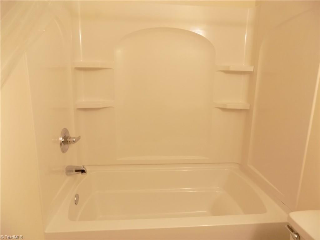 3104 Tyro Road Lexington, NC 27295 - Photo 24 of 28 Deep tub/shower surround recently added with shelves for shampoo and products.
