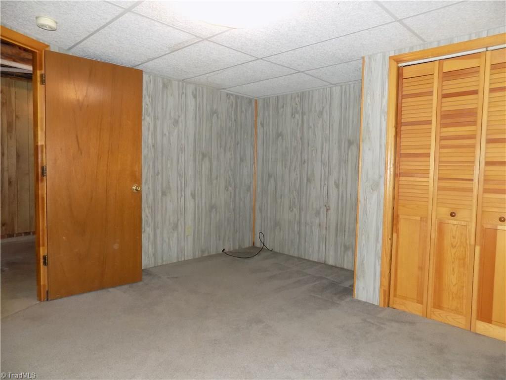3104 Tyro Road Lexington, NC 27295 - Photo 25 of 28 Finished heated/cooled room in basement level great for an office or man cave. Not included in square footage.