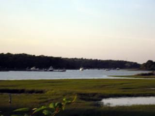 68 Bayview Road Mashpee, MA 02649 - Photo 2 of 10 a view of a town with an ocean beach