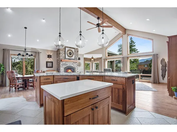 a kitchen with a sink and a large window