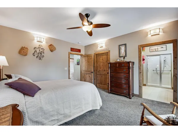 a bed room with a bed and a window