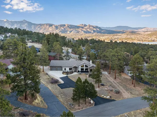 an aerial view of residential houses and outdoor space