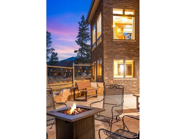 a view of a chairs and table in the patio