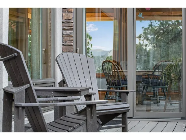 a view of balcony with two chairs and a table