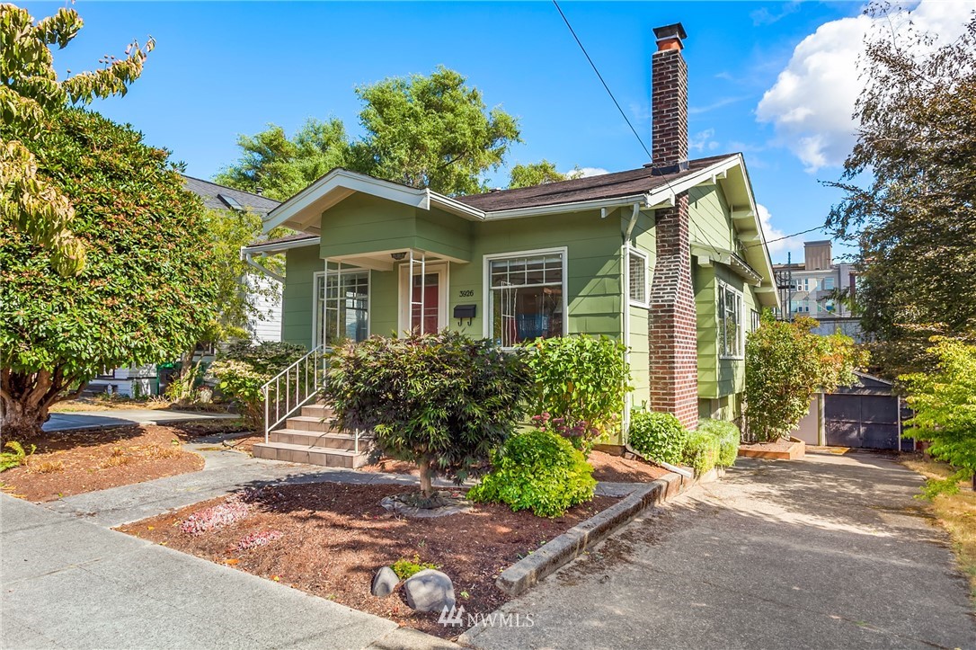 3926 Midvale Avenue North Seattle, WA 98103 - Photo 2 of 25 a front view of a house with garden