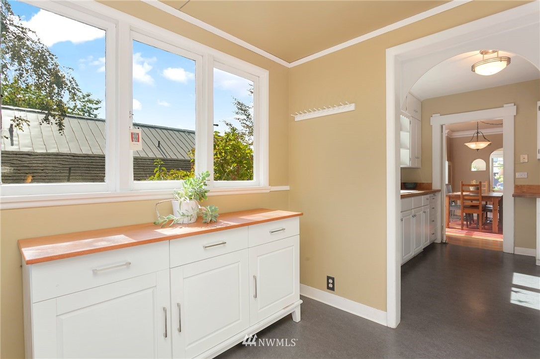 3926 Midvale Avenue North Seattle, WA 98103 - Photo 12 of 25 a hallway with sink and mirror