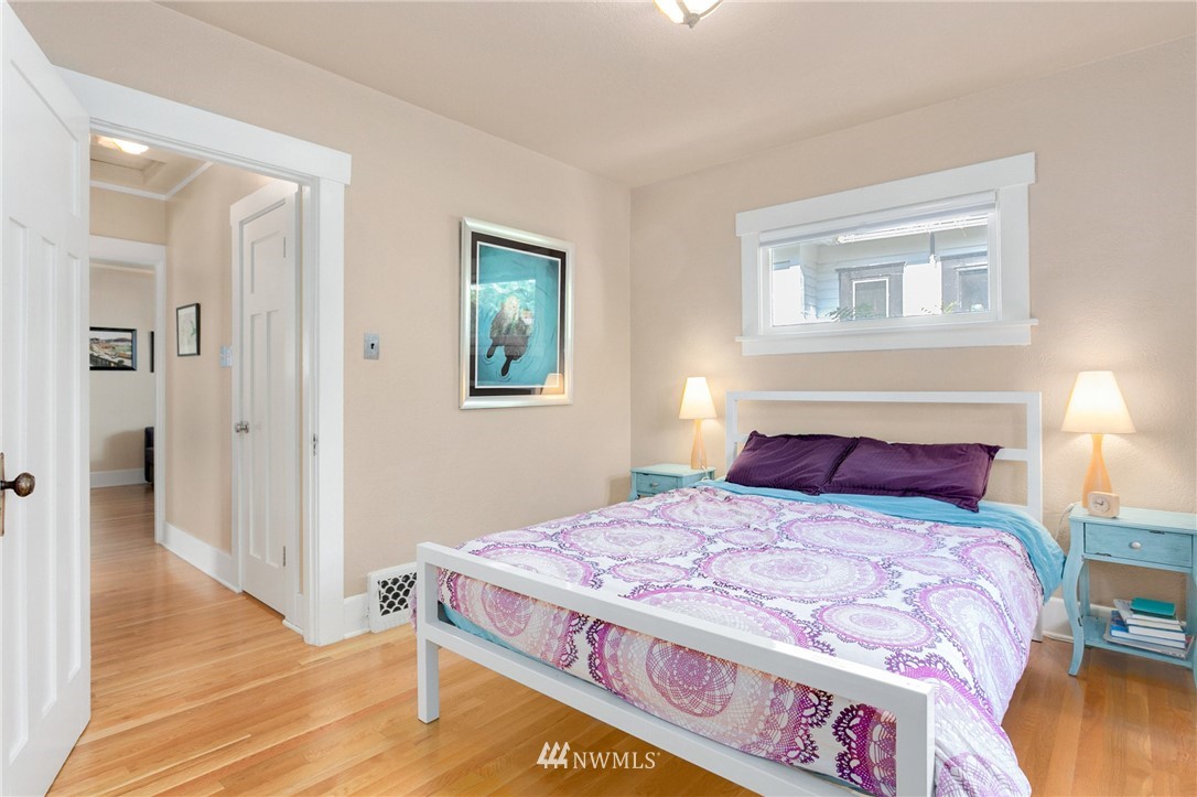 3926 Midvale Avenue North Seattle, WA 98103 - Photo 15 of 25 a bedroom with a bed and a painting on the wall
