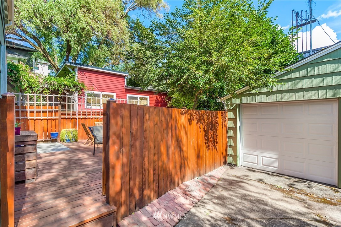 3926 Midvale Avenue North Seattle, WA 98103 - Photo 21 of 25 a view of a backyard with a wooden fence