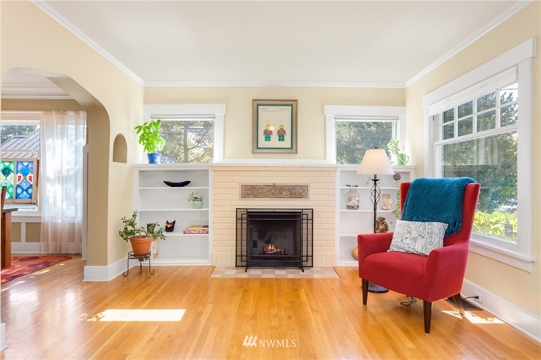 3926 Midvale Avenue North Seattle, WA 98103 - Photo 4 of 25 a living room with furniture and a fireplace