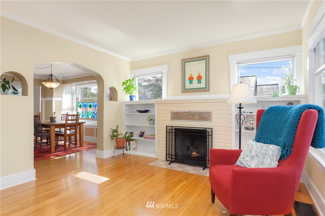 3926 Midvale Avenue North Seattle, WA 98103 - Photo 5 of 25 a living room with furniture and a fireplace