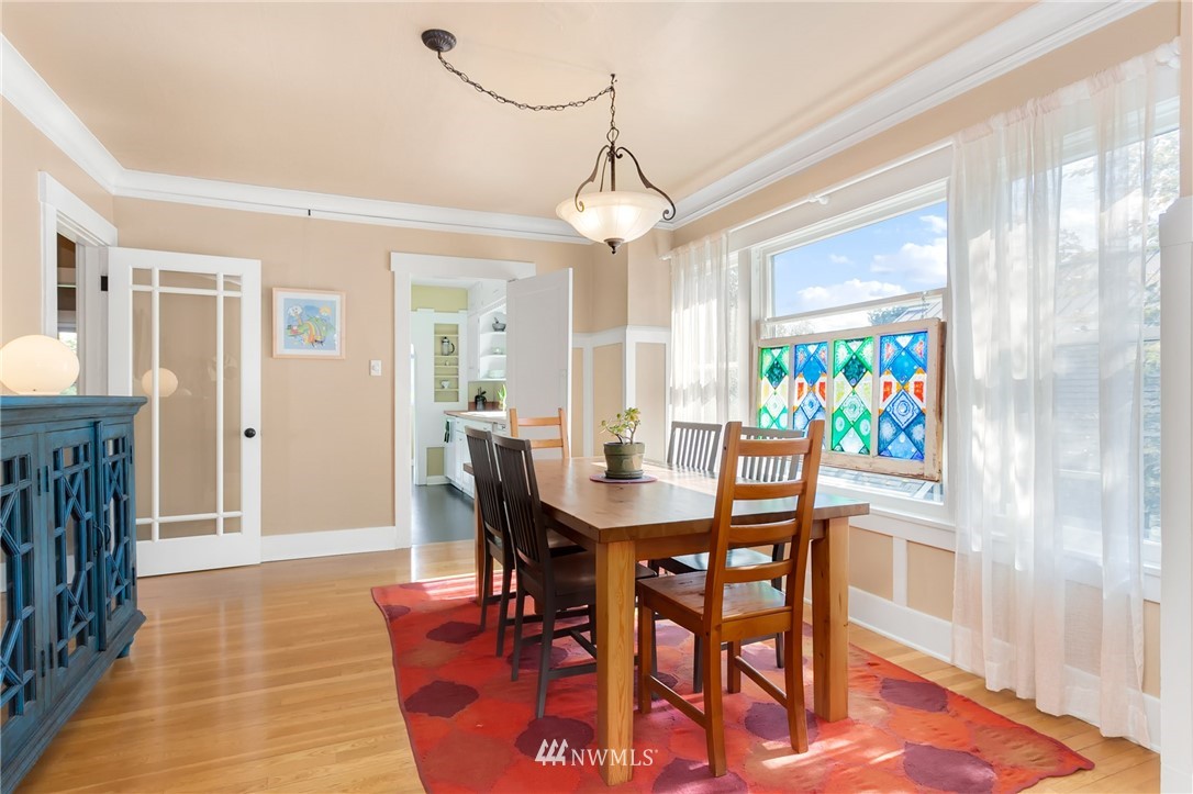 3926 Midvale Avenue North Seattle, WA 98103 - Photo 8 of 25 a view of a dining room with furniture and wooden floor