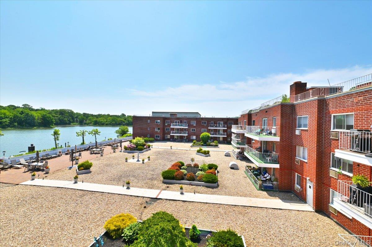 320 East Shore Road, Unit 6B Great Neck, NY 11023 - Photo 8 of 17 a view of a terrace with lawn chairs