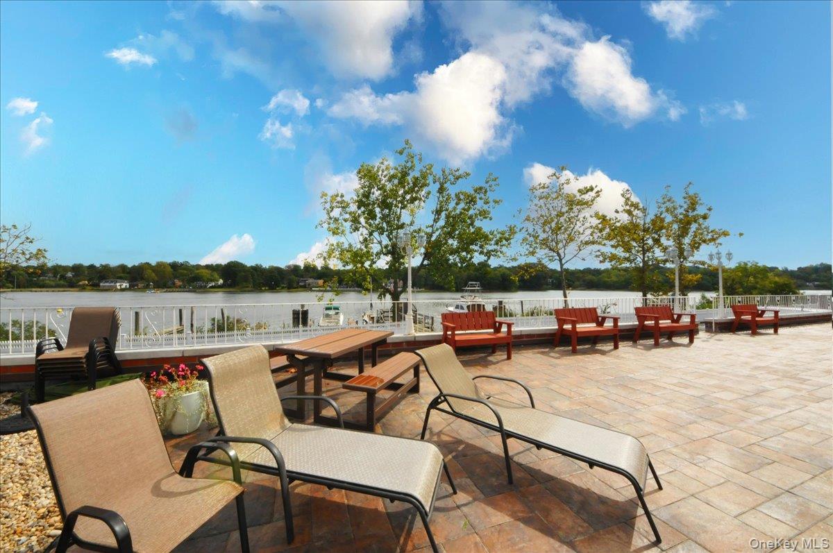 320 East Shore Road, Unit 6B Great Neck, NY 11023 - Photo 9 of 17 a view of a patio with swimming pool