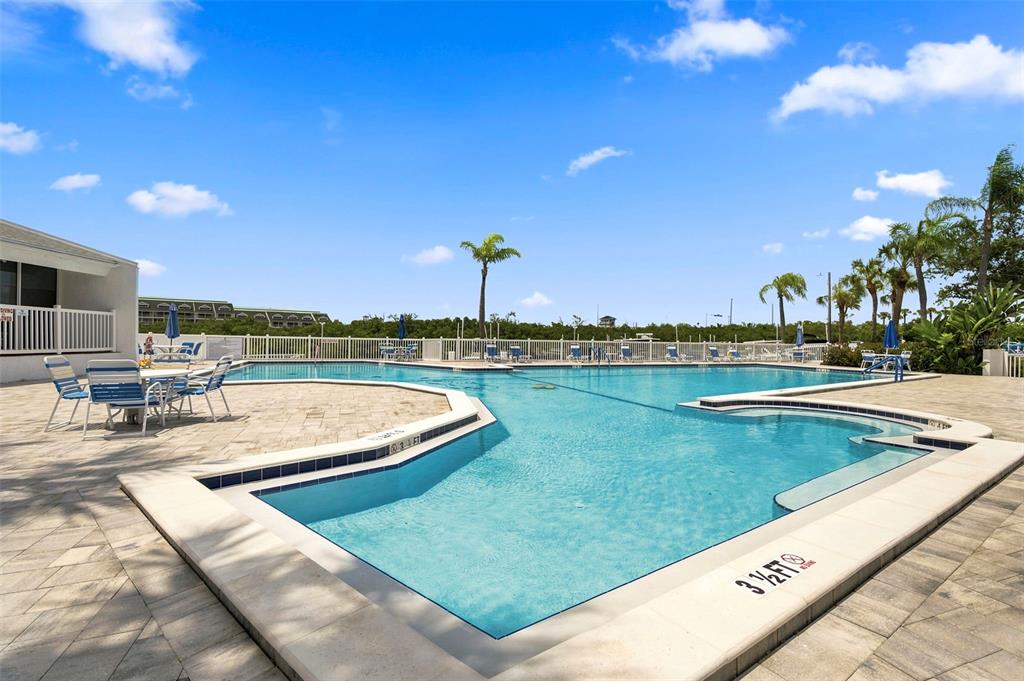 14800 Walsingham Road, Unit 702 Largo, FL 33774 - Photo 35 of 42 a view of a swimming pool and an outdoor space