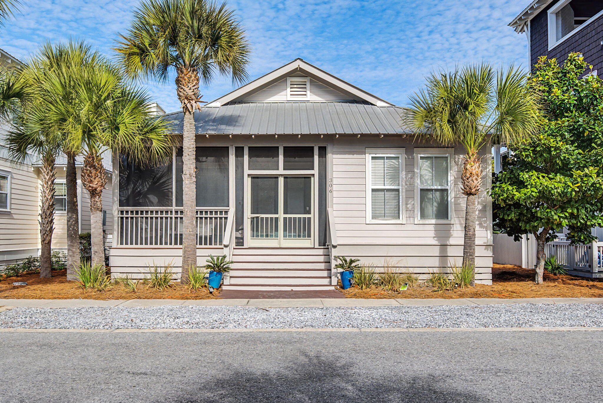 306 Beach Bike Way Inlet Beach, FL 32461 - Photo 1 of 33 a front view of a house with a yard and garage