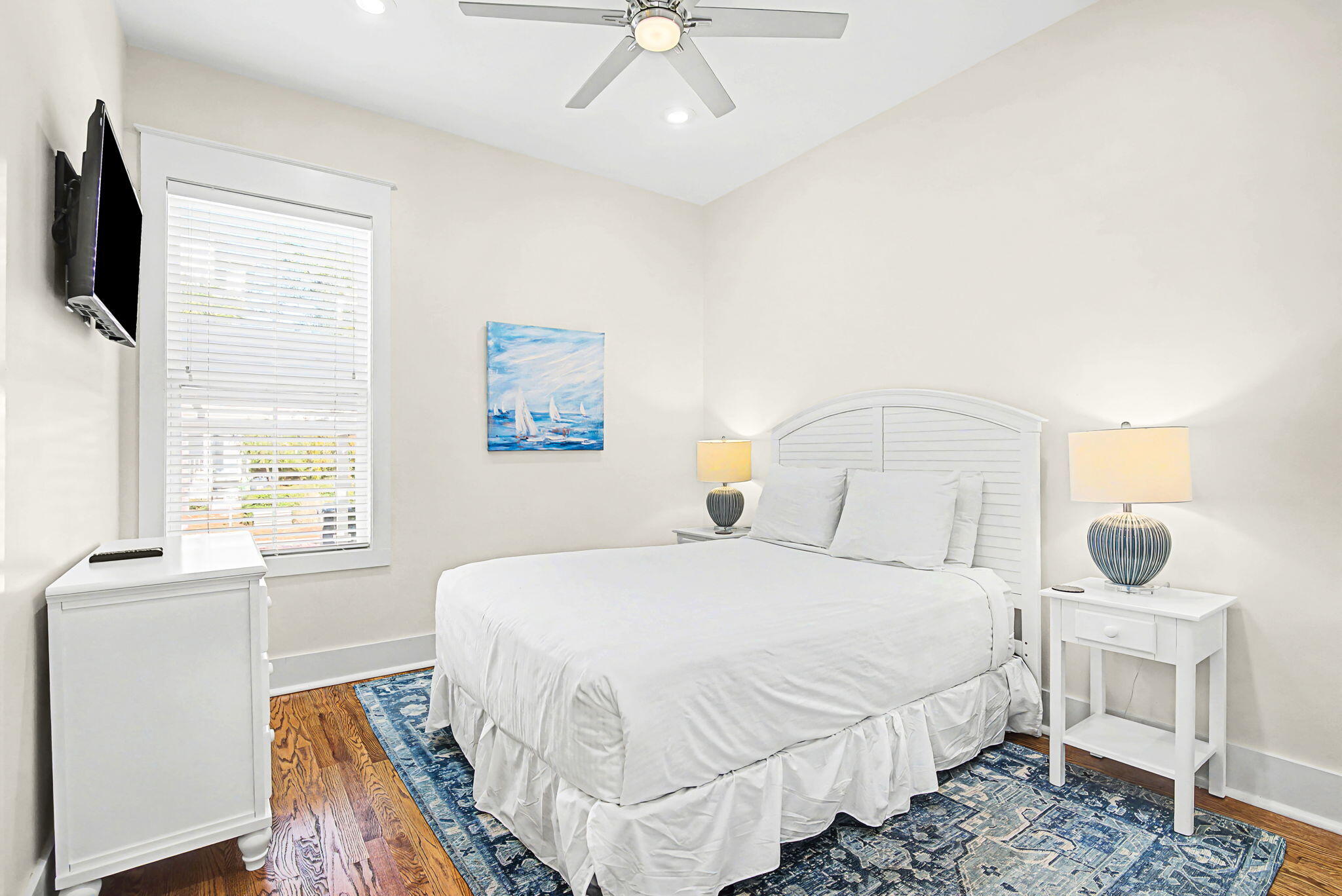 306 Beach Bike Way Inlet Beach, FL 32461 - Photo 18 of 33 a bedroom with a bed a flat screen tv and a window